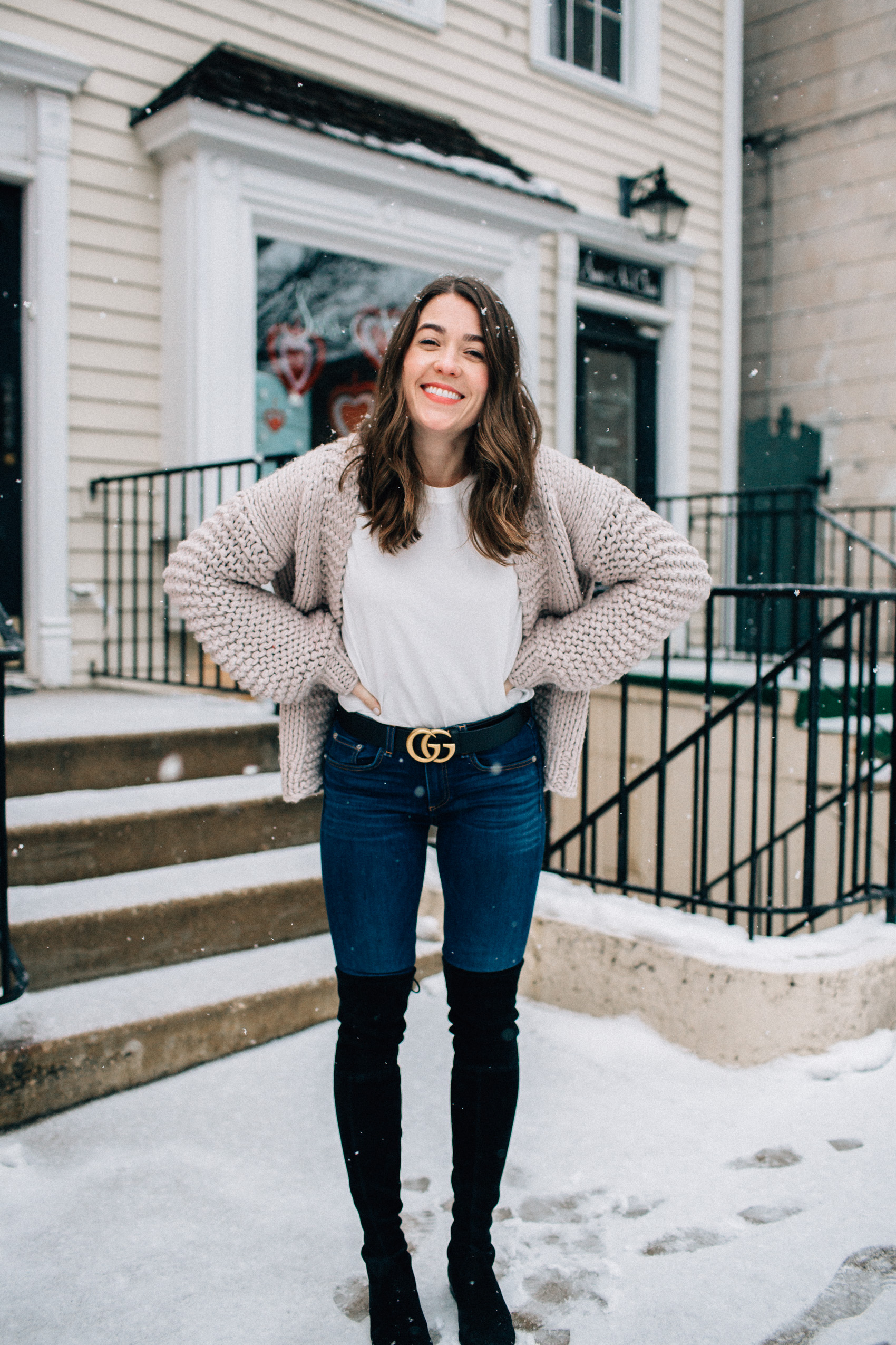 valentine's day casual outfit blue jeans gucci belt black stuart weitzman over the knee boots