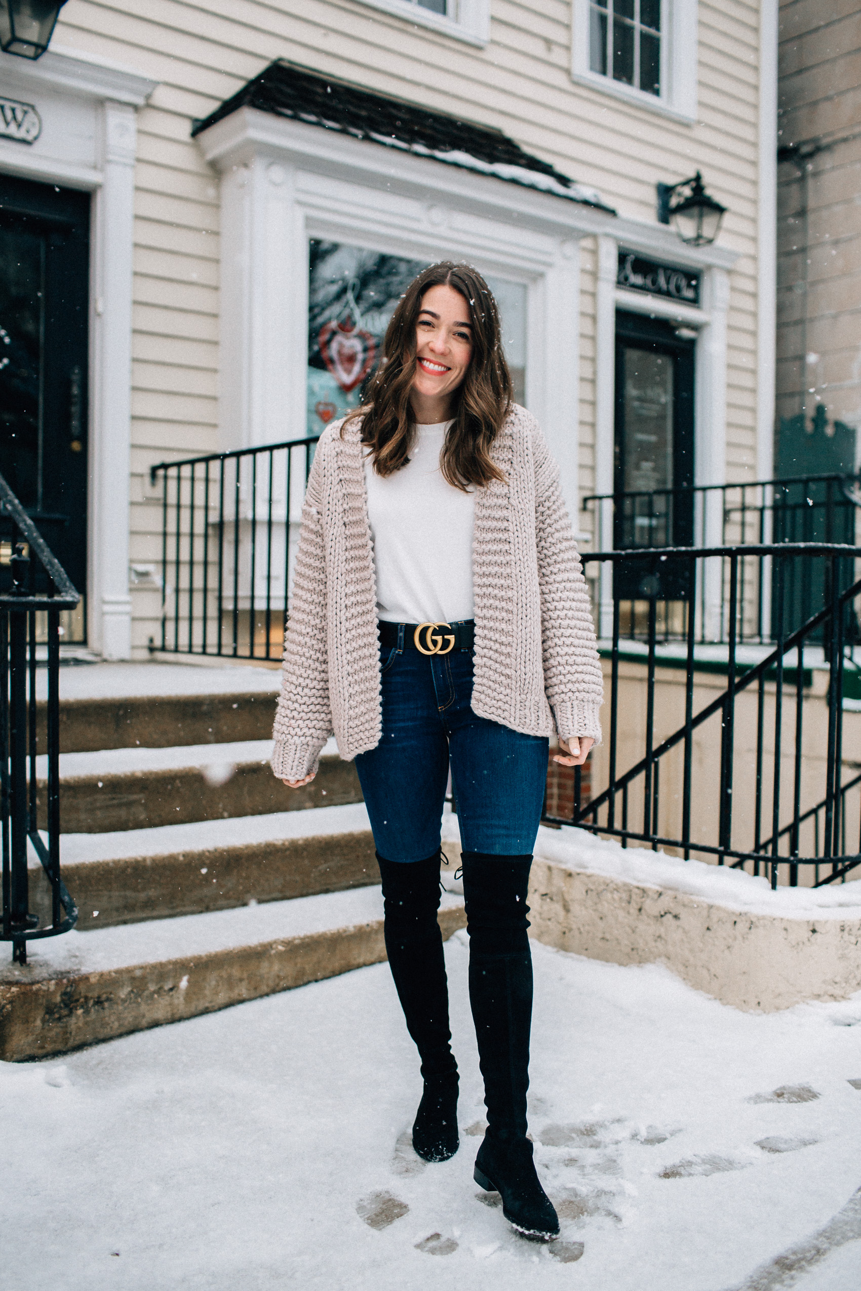 valentine's day casual outfit blue jeans gucci belt black stuart weitzman over the knee boots