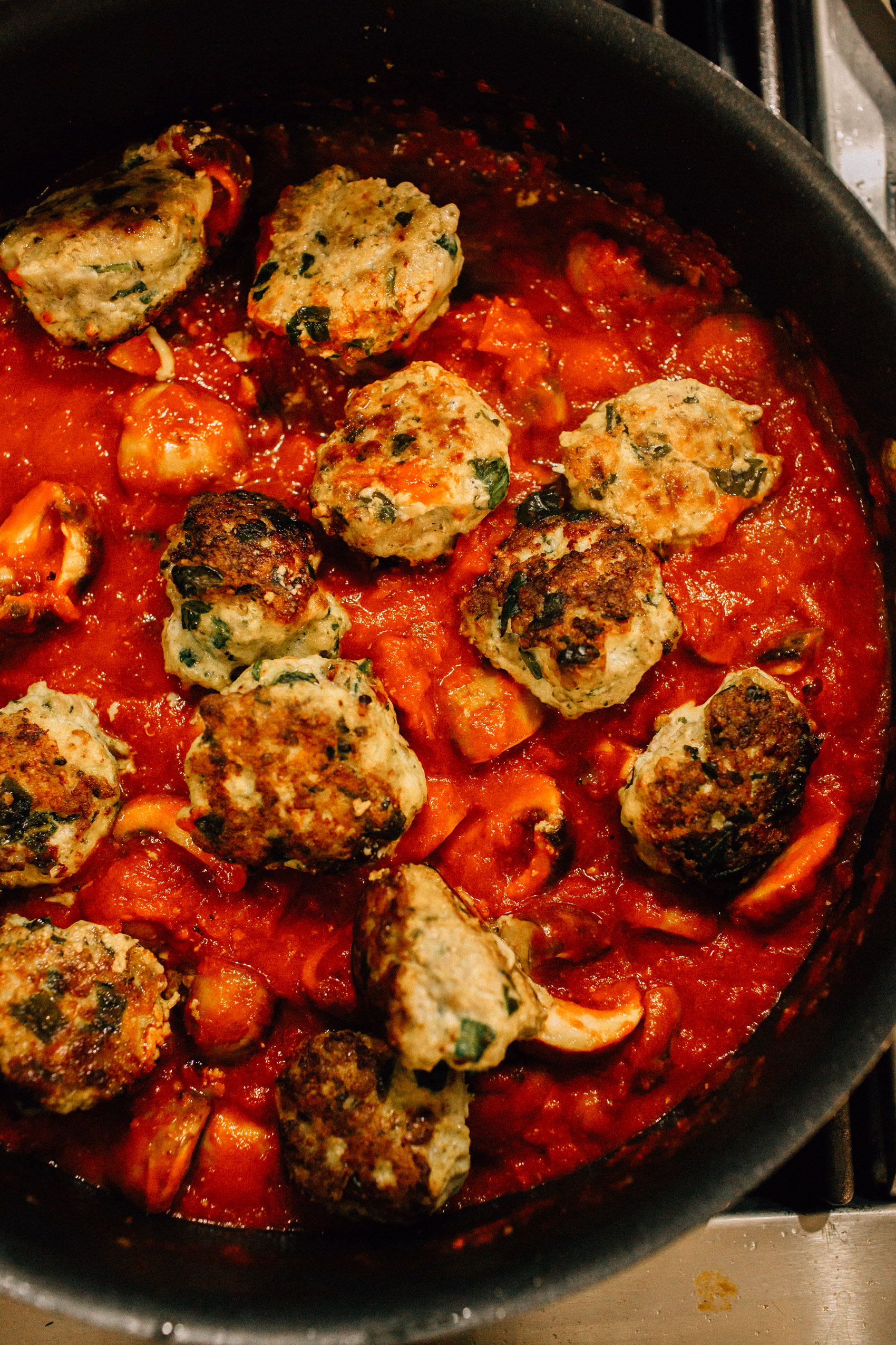 easy family weeknight turkey meatball recipe cooking in one single skillet with tomato sauce
