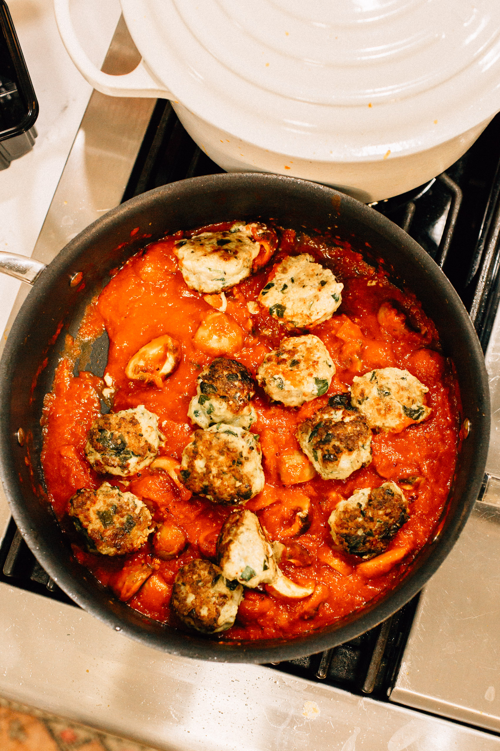 easy family weeknight turkey meatball recipe cooking in one single skillet with tomato sauce