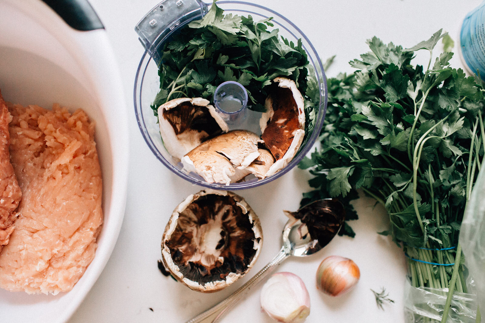 healthy turkey burger ingredients mushroom parsley in food processor with ground turkey burger