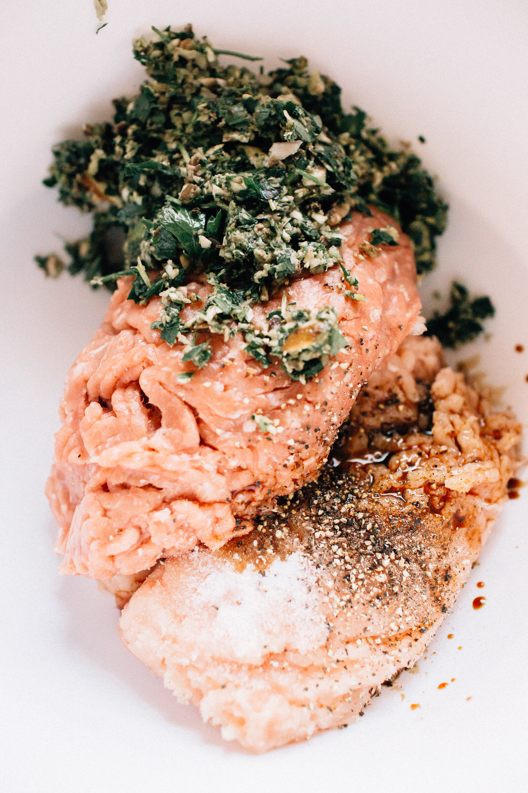 how to make healthy turkey burgers mixing ground mushrooms and parsley with ground turkey to make patties