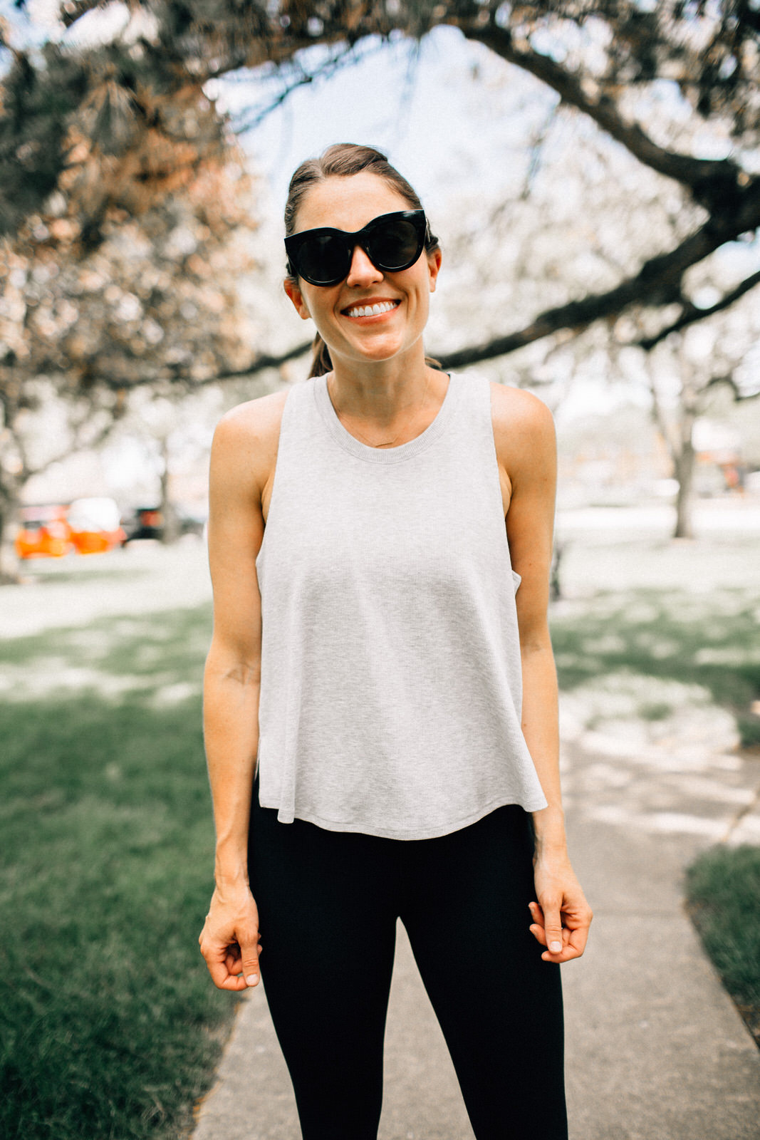 nordstrom anniversary sale fitness outfit grey zella tank black nike leggings