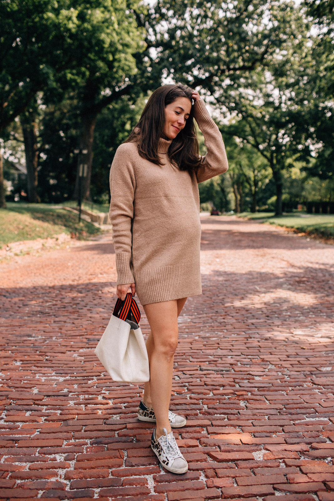 Liz Adams wearing sweater dress for fall from Amazon with Clare V. leather tote and Golden Goose sneakers how to style sweater dresses for fall
