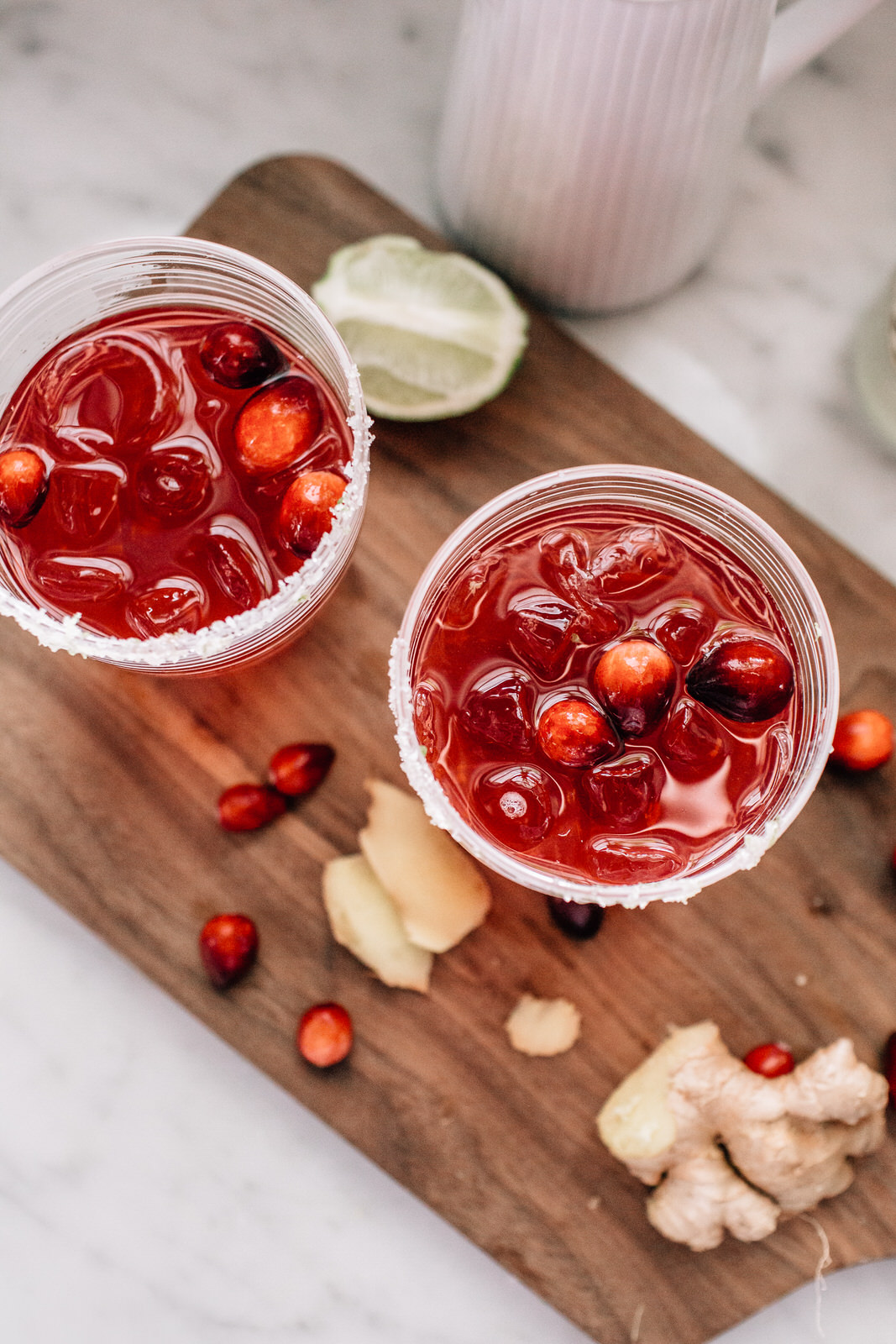 <div itemscope itemtype="https://schema.org/Recipe">
<span itemprop="name">
Cranberry Ginger Margarita</span>
<span itemprop="description">
A festive + refreshing holiday cocktail!</span>
<span itemprop="aggregateRating">
Aggregate rating will show here</span>
<meta itemprop="url"
content="https://myrecipesite.com/pineapple.html" />
<span itemprop="recipeYield">Serves 1</span>
Ingredients:
<span itemprop="ingredients">ingredient 1</span>,
<span itemprop="ingredients">ingredient 2</span>,
<span itemprop="ingredients">ingredient 3</span>,
<span itemprop="ingredients">
for simple syrup:
1 cup granulated sugar
3/4 cup water
1 cup fresh ginger (skin removed + cut into 1" pieces)
for the sugar rim:
1/2 cup salt
1/2 cup granulated sugar
zest of one lime
for the cocktail:
your favorite tequila
cranberry juice
ginger beer or club soda</span>.
Instructions:
<span itemprop="recipeInstructions">
To make the sugar rim: combine 1/2 cup salt, 1/2 cup sugar and the zest of one lime. Mix together!
To assemble your cocktail: Rim your glass, add ice and then 1-2 oz of tequila, 1 tsp of your ginger simple syrup, a splash of cranberry juice and top with ginger beer or club soda. Top with fresh cranberries as garnish. Sip and enjoy!
*my personal preference is to add not too much cranberry juice. It is a little bitter and a little goes a long way. I don't want the cranberry juice to take over the flavor of the margarita. Play with your proportions because your preference may be different!</span>
</div>