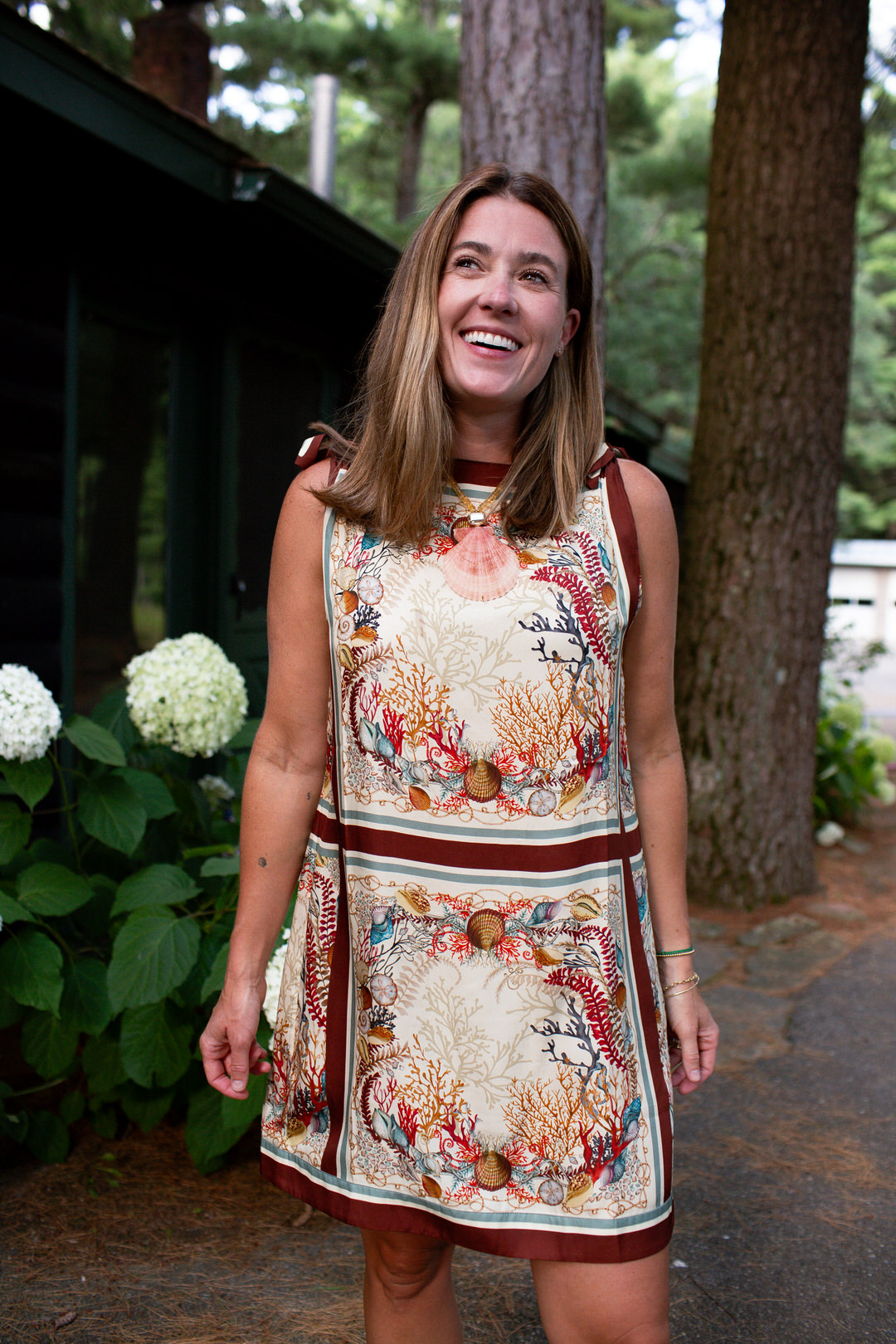 shell print dress with shell necklace